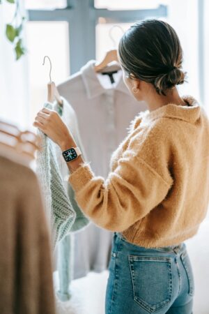 Photo by Liza Summer: https://www.pexels.com/photo/anonymous-woman-choosing-outfit-in-store-6347546/