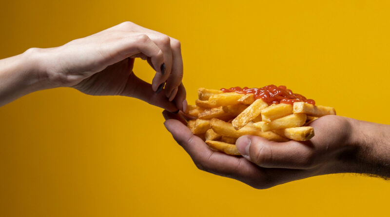 Photo by cottonbro studio: https://www.pexels.com/photo/person-sharing-french-fries-4676404/