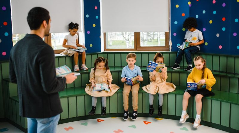 Photo by Anastasia Shuraeva: https://www.pexels.com/photo/man-reading-in-front-of-children-8466901/