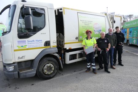 Natasha Mcintosh from the South Hams waste team, Dave Harvey and Alfie Bull from Devon and Somerset Fire & Rescue Service, and South Hams Lead Executive Member for Waste, Cllr Julian Brazil, beside one of our South Hams refuse lorries, armed with household items that contain lithium-ion batteries.
