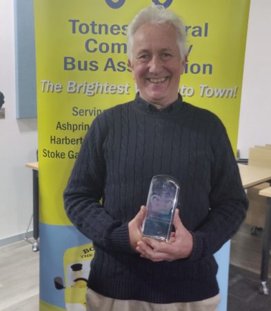 Driver Nic Evans gets a go with the award!