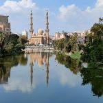 Photo by Abd Elhamid Zaki: https://www.pexels.com/photo/mosque-behind-lake-in-town-14187222/